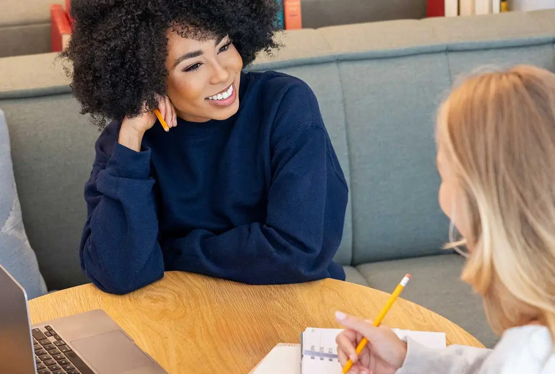 two young women talking